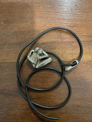 Silver pendant with embracing couple used, vintage