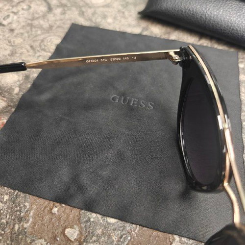 Guess women's sunglasses with black protective case and cloth