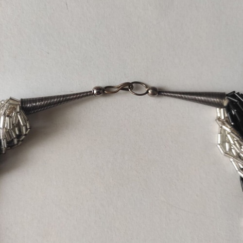 Braided necklace 57 cm like new, black and silver