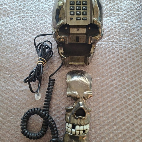 Decorative skull-shaped phone used, wired