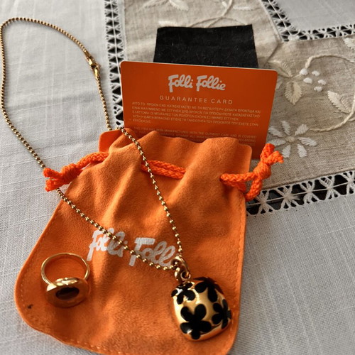 Folli Follie necklace and ring set, gold with black daisies and purple stone