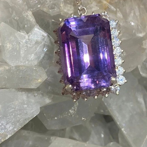 Silver pendant with large cut natural amethyst stone and moissanites