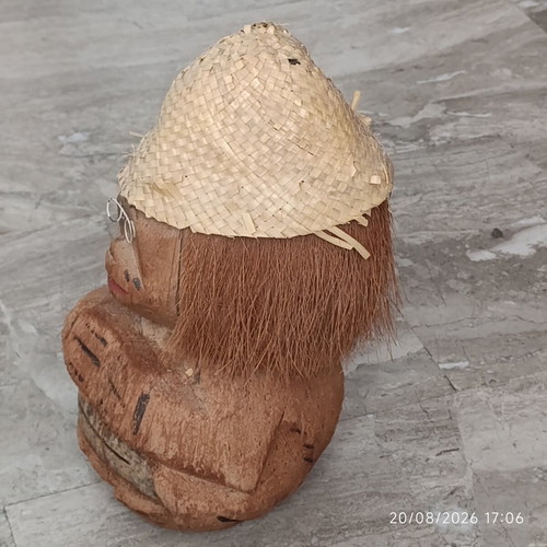 Handmade coconut shell money box with straw hat
