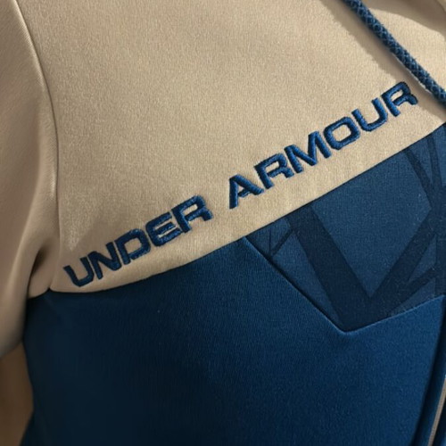 Under Armour hoodie used, fleece lining, pockets, white and blue