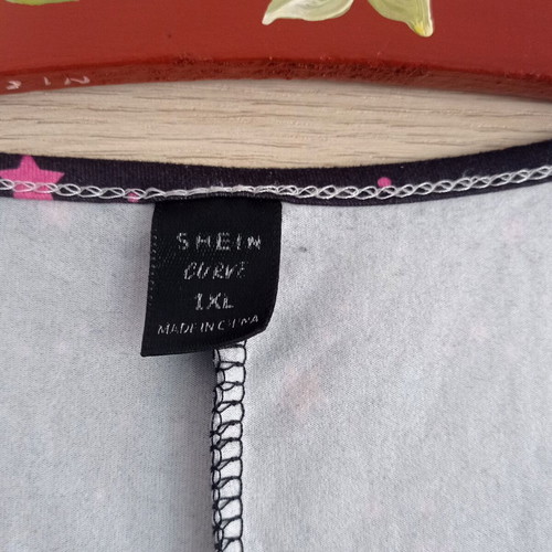 Shein black top with cutout shoulders and star print XL used