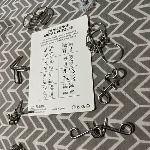 Challenge metal puzzles board game like new