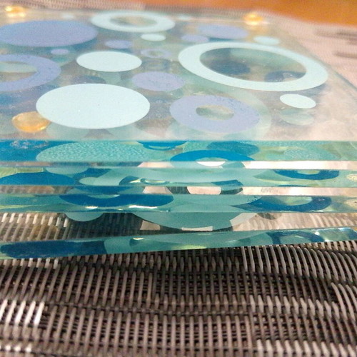 Glass coasters like new, set of 4 with blue details