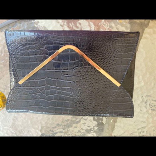 Blue clutch bag used with gold detail