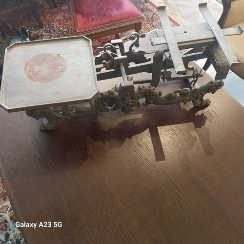 Cast iron antique scale used with lion and dragon decorations