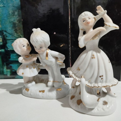 Porcelain figurines set used, young girl with goose and children