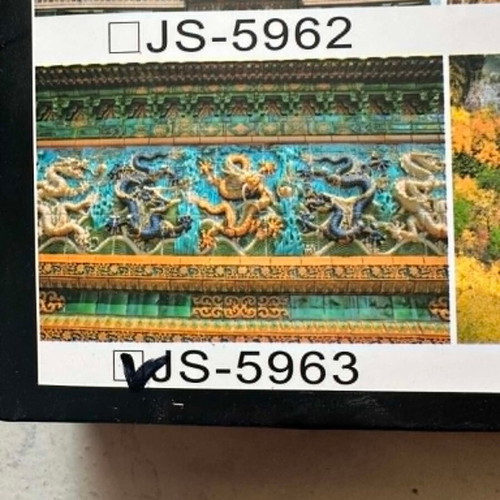 Two puzzles with 300 and 644 pieces, Chinese dragon relief and space planets