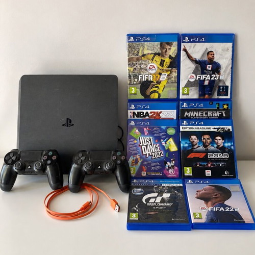 Sony PlayStation 4 (PS4) console with controller and 8 games