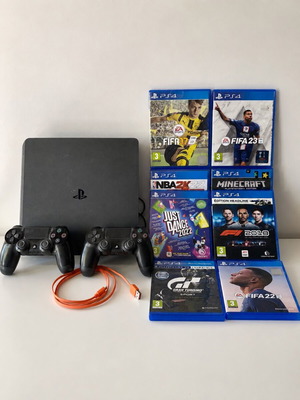 Sony PlayStation 4 (PS4) console with controller and 8 games