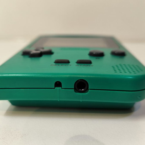 Game Boy Pocket Green console used with Test Drive 6 game