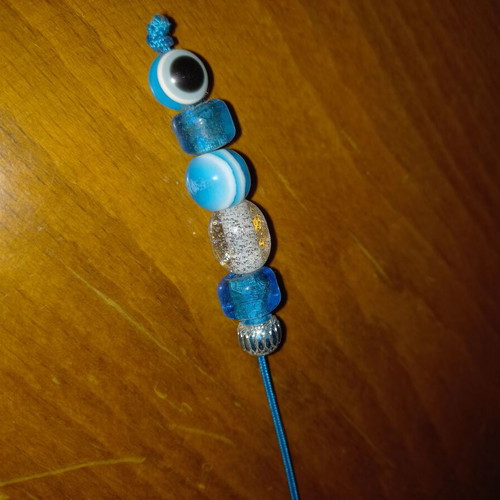 Small blue worry beads with eye stones