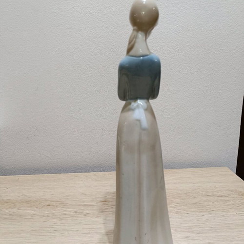 Porcelain figure of young woman like new, height 29 cm