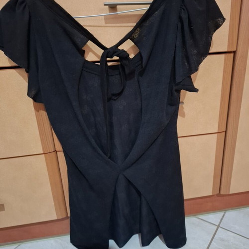 Backless blouse like new, black, with light transparency and embossed designs