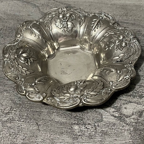 Decorative metal bowl used with embossed design