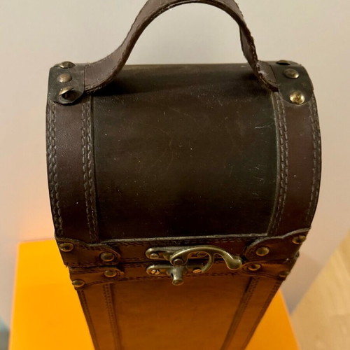 Decorative wooden case used with leatherette for bottle storage