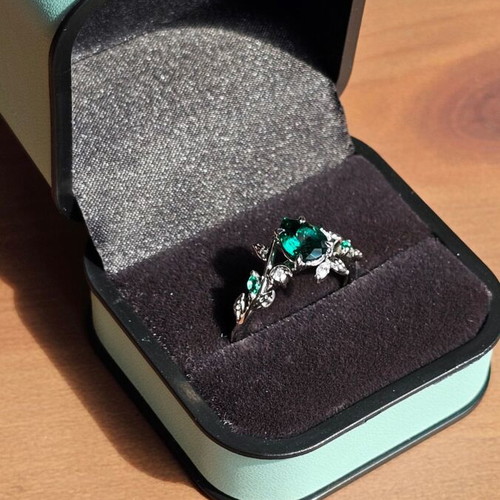 14K White Gold Engagement Ring with Emerald and Moissanite