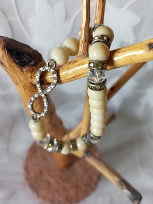 Bracelet with beads and infinity symbol new, cream and silver