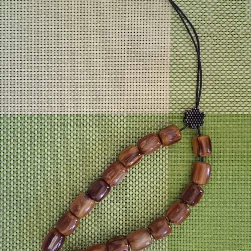 Komboloi with Brown-Honey Beads like new, 17 beads, metal decorations