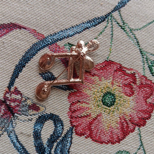 Pin used, white and gold with defect