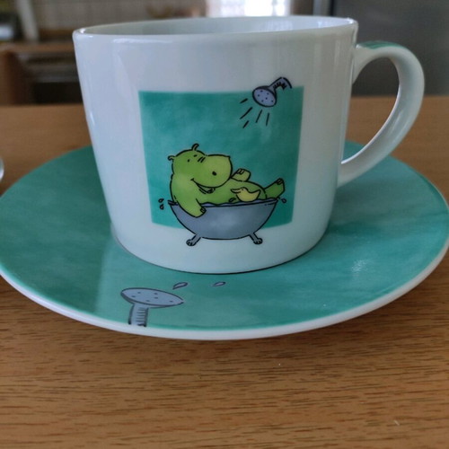 Set of 2 coffee cups with saucers like new, turquoise with hippopotamus