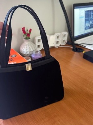 Handheld bag like new, black with minor mark