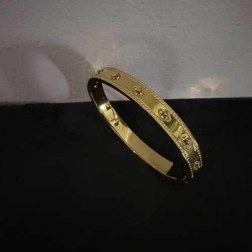 Bracelet new, gold color, stainless steel with designs