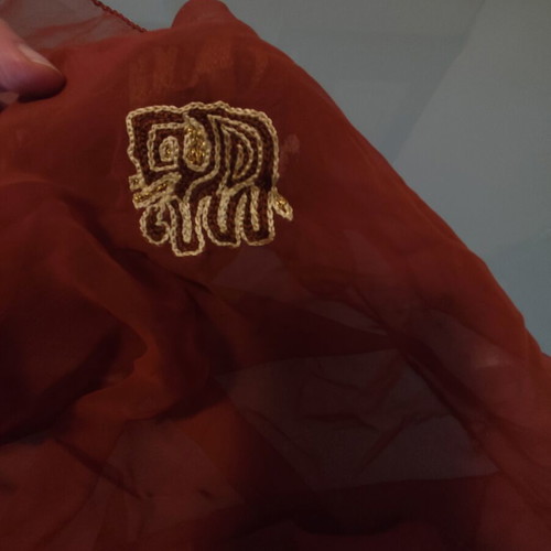 Long brown scarf used with embroidered elephants and paisley