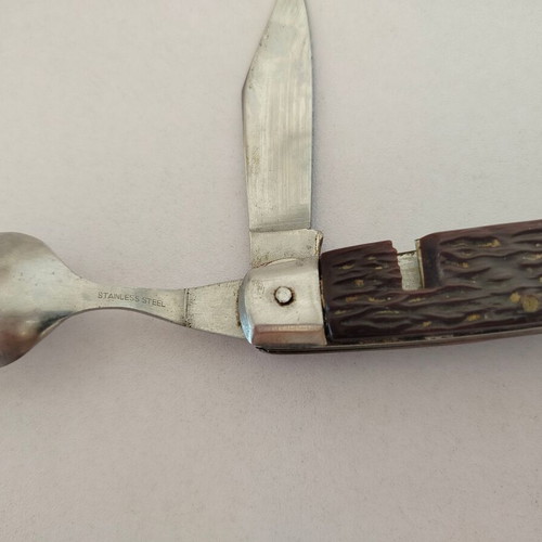 Vintage pocket knife with integrated fork and spoon, used