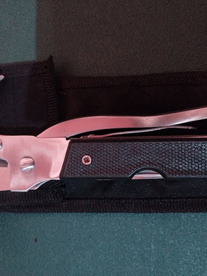 Multipurpose tool new with hammer, fork, and pliers