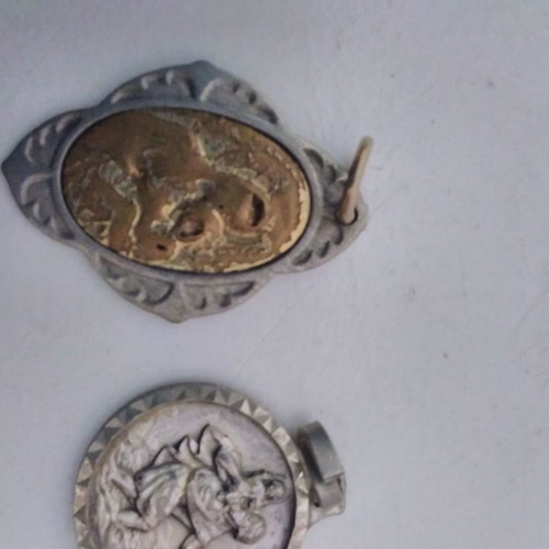 Silver pendant necklace used with zodiac and catholic figures