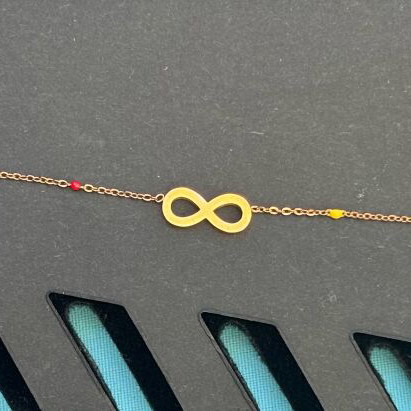 Bracelet with infinity symbol and colorful stones stainless steel like new