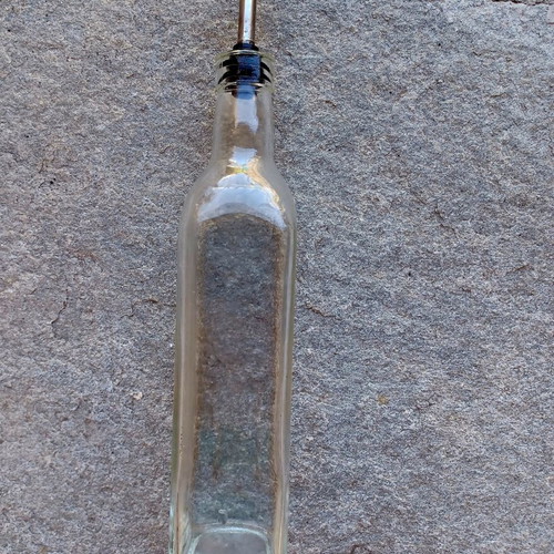 Glass bottle with pour spout for oil and vinegar used