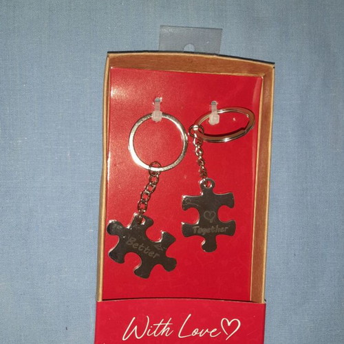 Keychain set with puzzle pieces and "Better Together" message, new