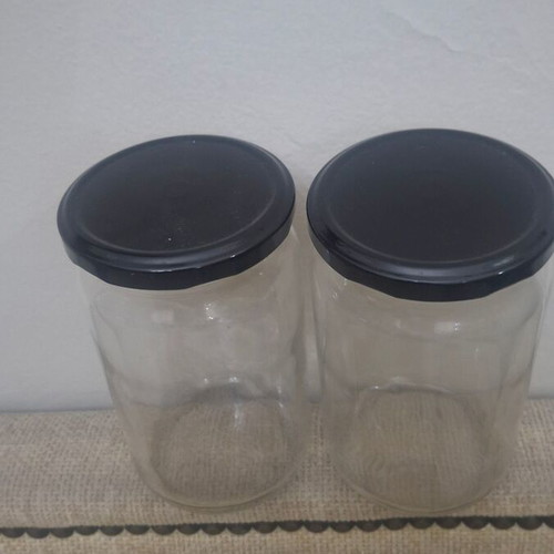 Set of 10 transparent glass storage jars with black metal lids