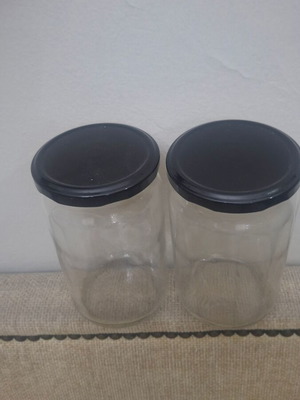 Set of 10 transparent glass storage jars with black metal lids