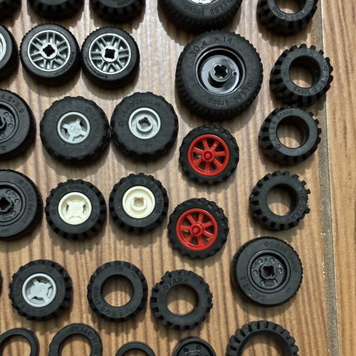 Lego wheels set like new, 65 parts including tires and inner pieces