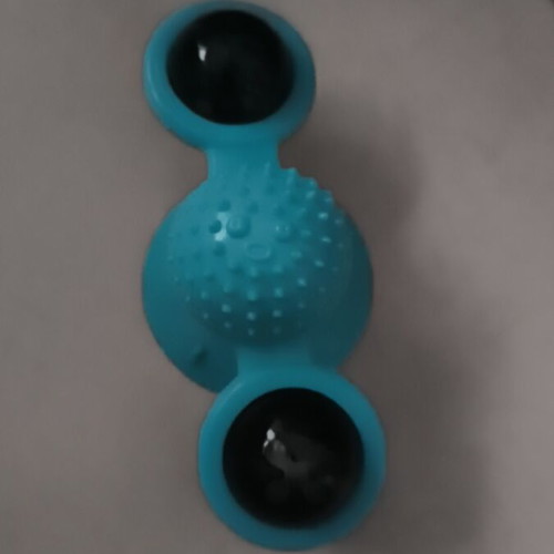Cat toy with suction cup and treat dispenser