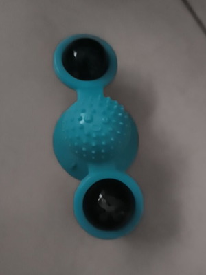 Cat toy with suction cup and treat dispenser