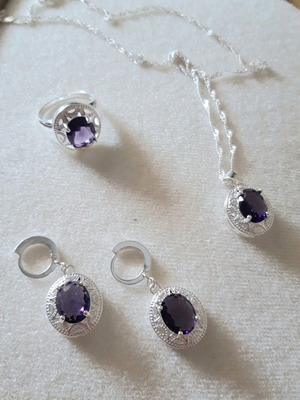 Silver jewelry set with purple stone like new