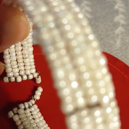 Vintage bracelet used with multiple rows of tiny white beads