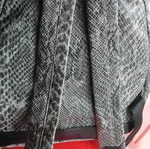 Snakeprint backpack used, grey with snake pattern and studs