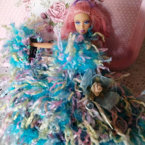 Doll with handmade dress and hat used