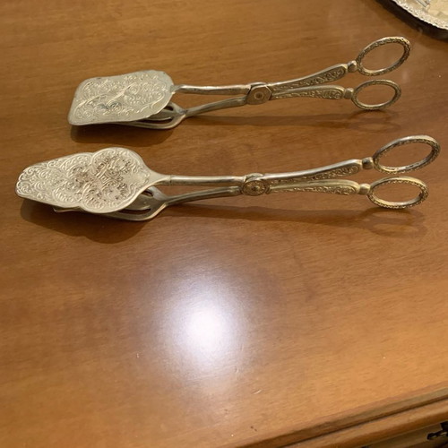Silver-plated serving spoon and fork set used