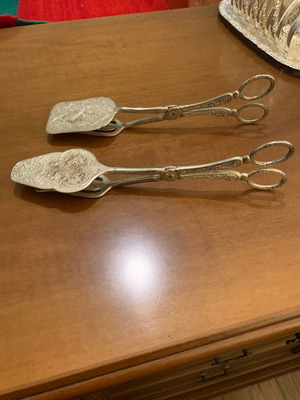 Silver-plated serving spoon and fork set used