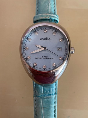 Oxette turquoise watch used with small rhinestones and date