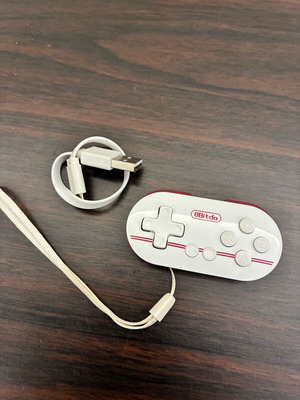 8BitDo Zero gamepad used with USB cable